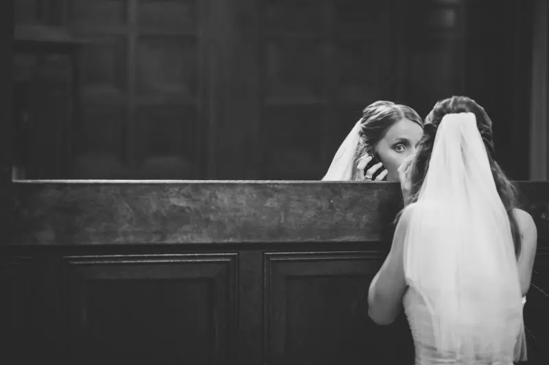 destination germany wedding, bride looking at her reflection in a mirror, black and white
