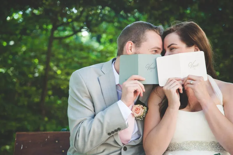 destination germany wedding, couple reading their vows in the garden