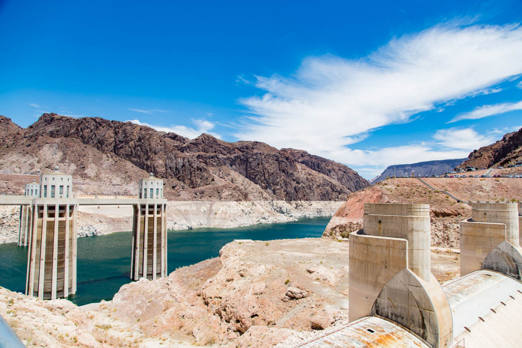 Hoover Dam intake towers and Lake Mead seen from the Nevada side with desert mountains and the power plant in the foreground